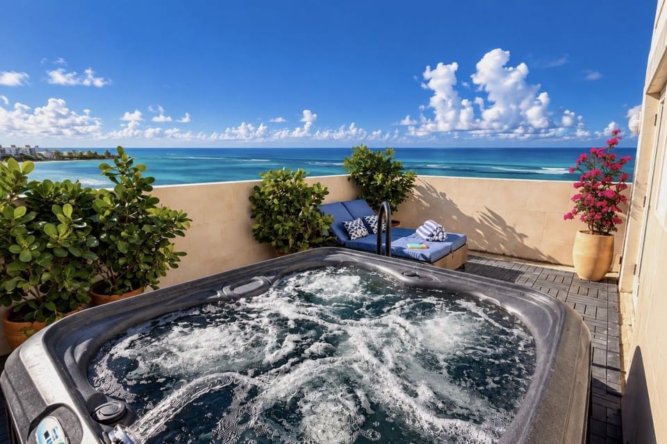 Luxury Terrace with hot tub, offering panoramic views of the beach and city skyline.