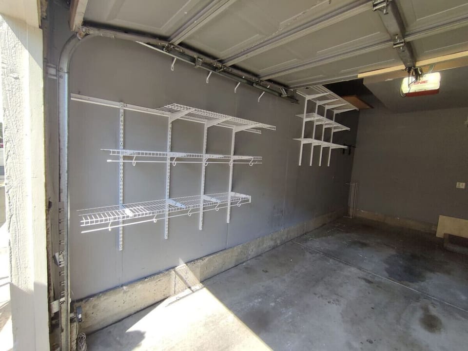 Secured garage with wall-to-wall shelves for your Colorado adventure gear.