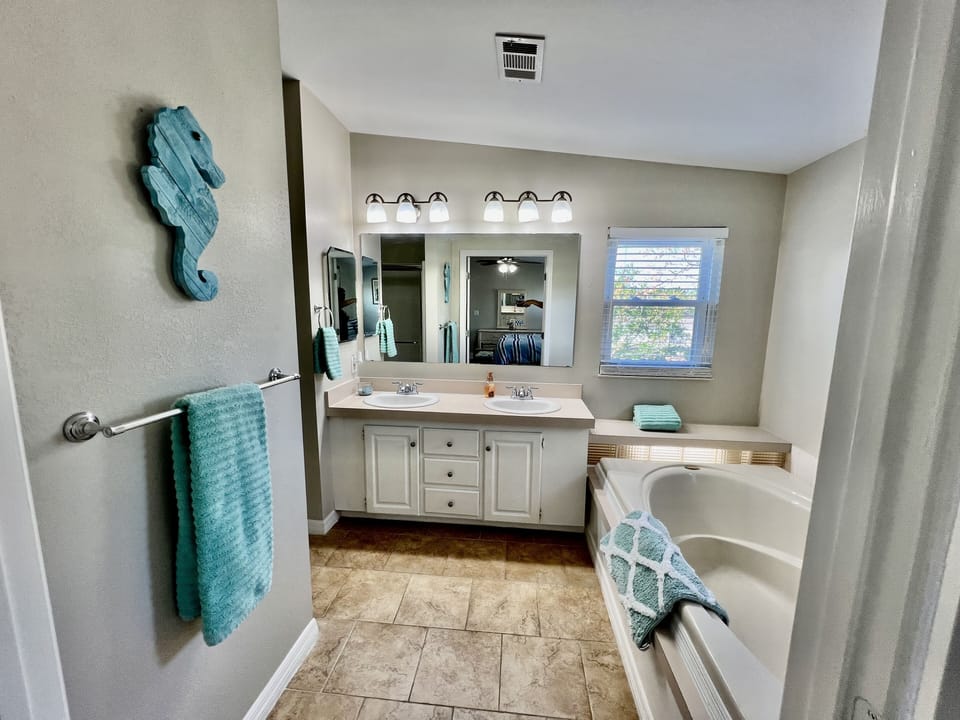 Master bath with double sinks, and garden tub