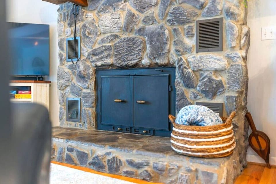 Gather around the fireplace in this spacious living room, where comfort and style meet.