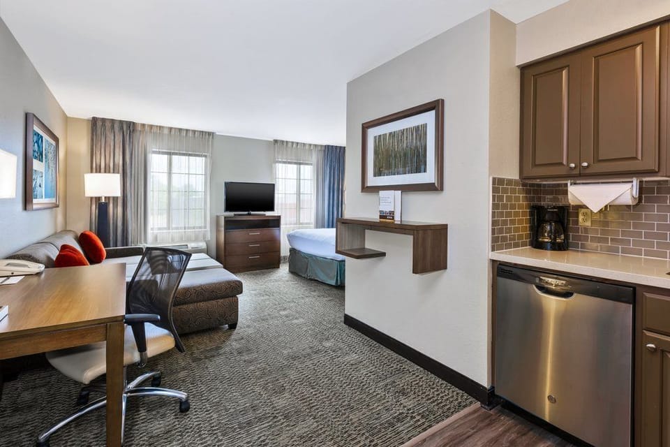 Enjoy a bright and spacious living area, perfect for work or leisure, complete with a kitchenette for your convenience.