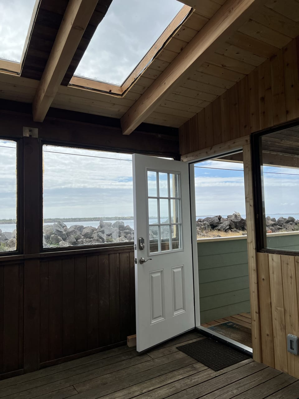 Main Entrance- enter into the sunroom.  Expansive water views. 
