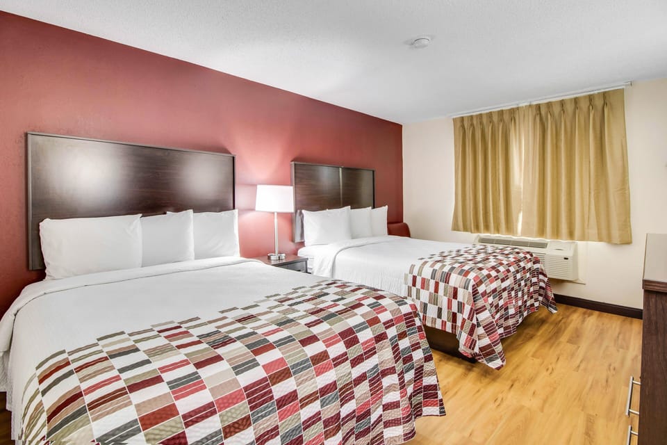 Deluxe Room, 2 Queen Beds, Non Smoking | Desk, blackout drapes, iron/ironing board, free cribs/infant beds