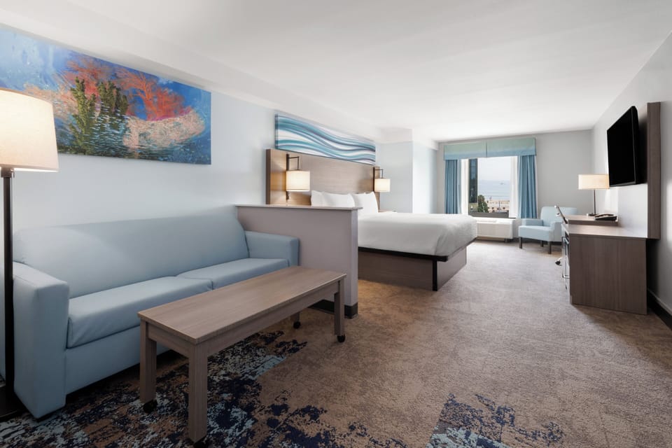 Standard Room, 1 King Bed with Sofa bed, Partial Ocean View | Desk, laptop workspace, blackout drapes, soundproofing