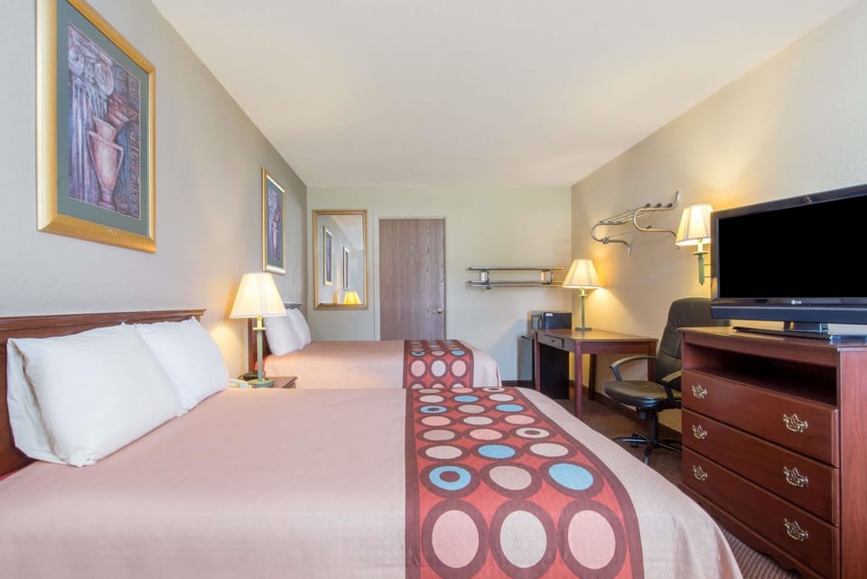 Desk, laptop workspace, blackout drapes, iron/ironing board