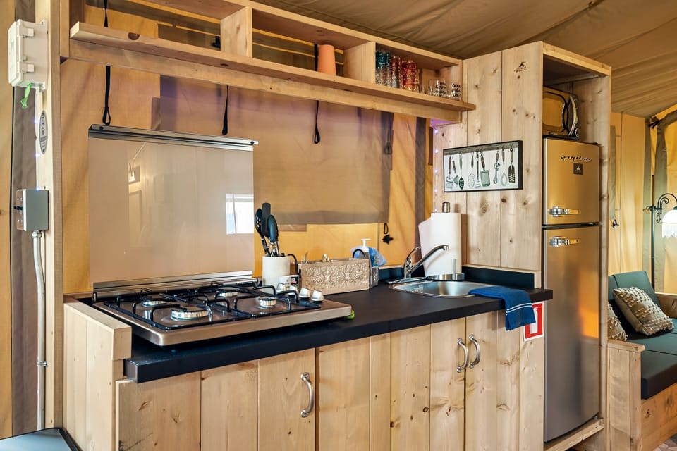 Kitchen with a 4 burner propane cooktop.