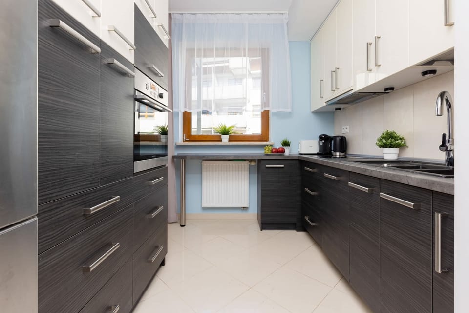 Kitchen with oven and refrigerator. 