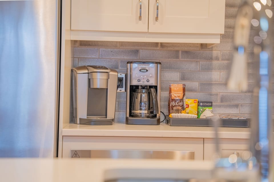 Brew your perfect morning cup with a choice of coffee makers, just steps away from your gourmet kitchen.