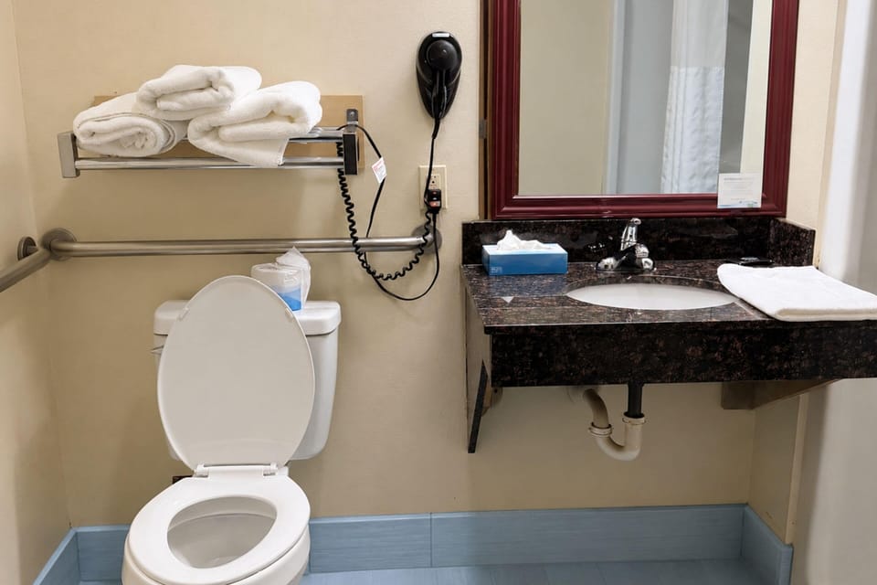 Standard Room, 2 Queen Beds, Non Smoking | Bathroom | Combined shower/tub, free toiletries, hair dryer, towels