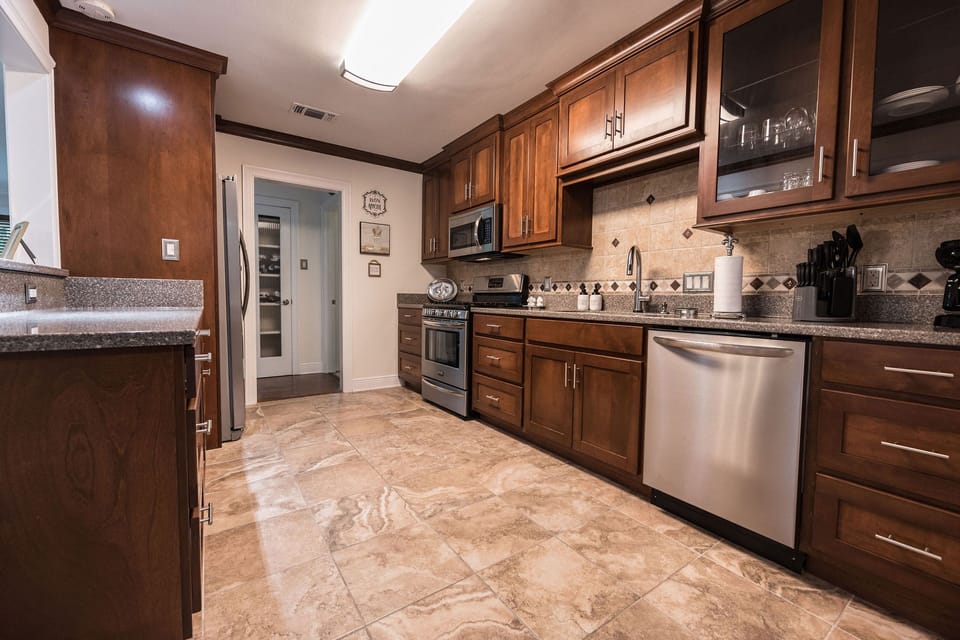 Full kitchen equipped with all basic cooking and dining necessities