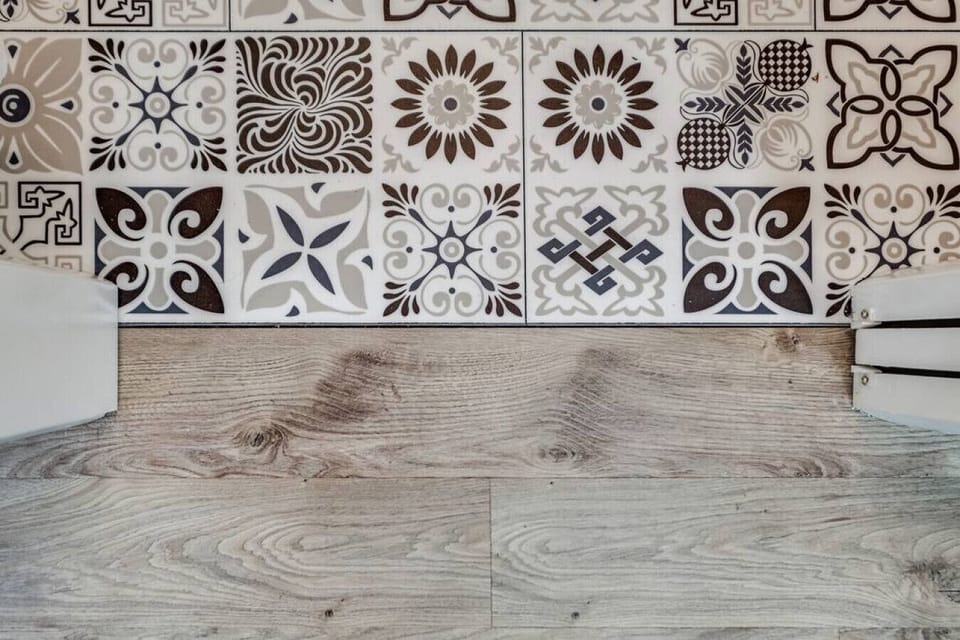 You can’t help but admire the ornate tile floors in the bathroom.