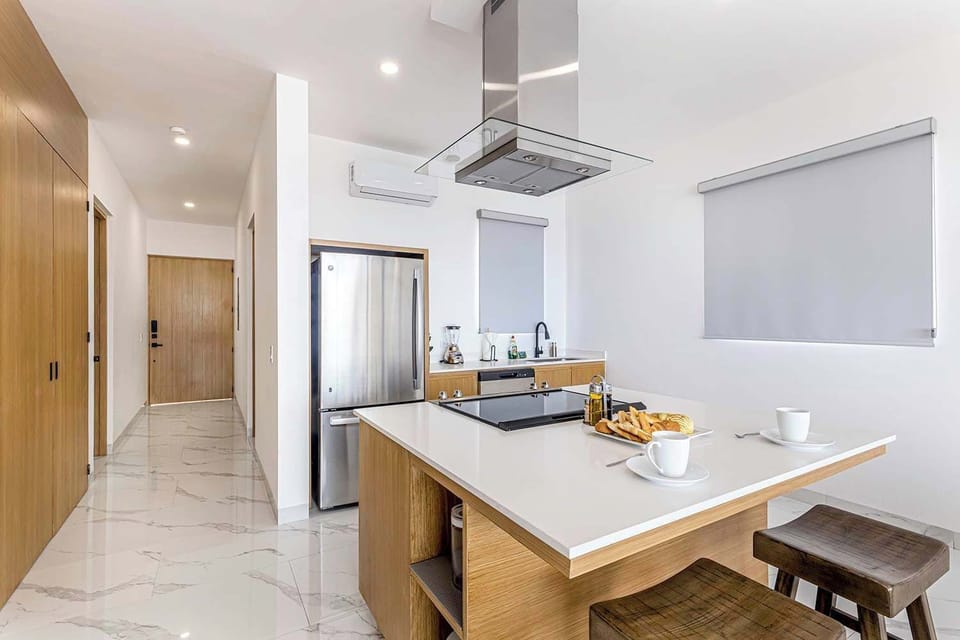 Fully equipped kitchen with stainless steel appliances.