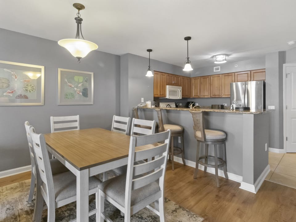 Gather around your stylish dining table for memorable meals, then chat over coffee at the breakfast bar in your well-appointed kitchen.