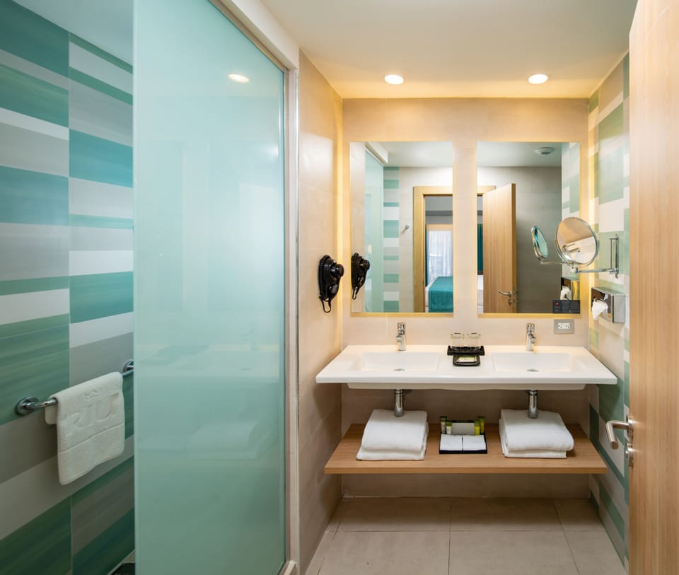Shower, rainfall showerhead, eco-friendly toiletries, hair dryer