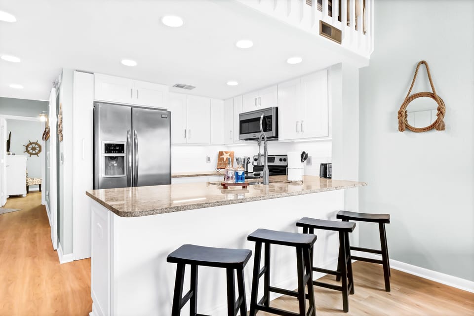 Peninsula Bar - seating for 4, Counter height.
