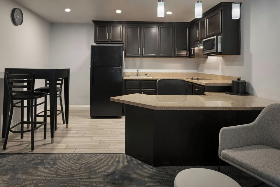 Suite, 1 Bedroom, Courtyard View | Living area | 42-inch Smart TV with satellite channels, Netflix, Hulu