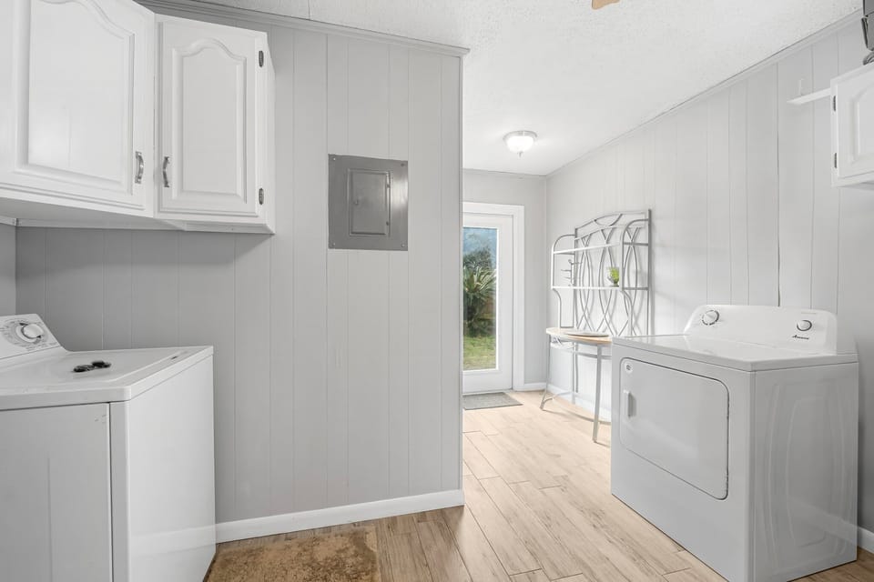 Dedicated laundry room with full-size washer and dryer — perfect for beach towels, sandy clothes, and longer stays.