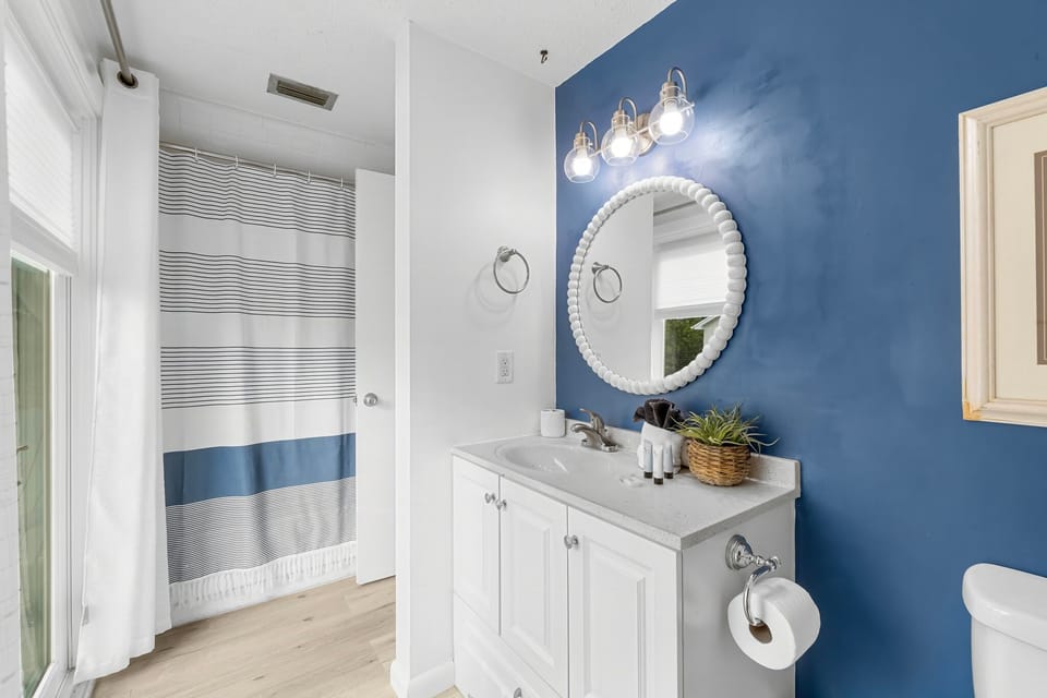 Full bed with Smart TV and private full bathroom with balcony access—perfect for couples or additional guests.