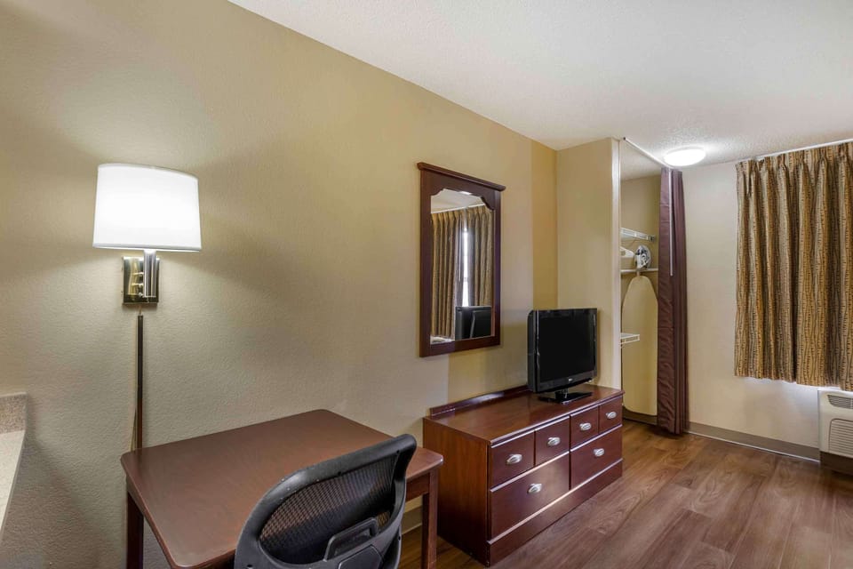 Desk, blackout drapes, iron/ironing board, bed sheets