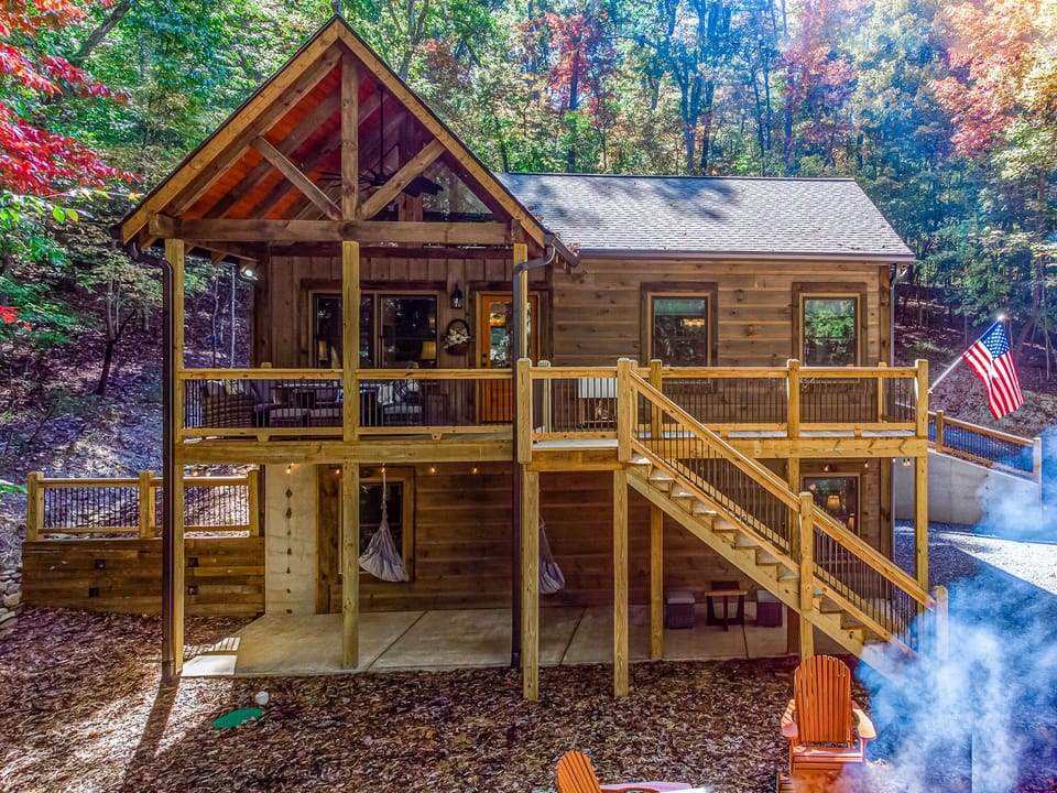 Bi Level Cabin with covered portion and out door furniture and fire pit
