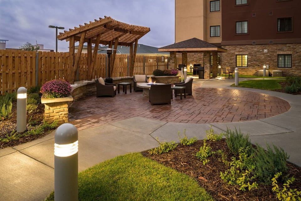 Unwind in the cozy outdoor space with stylish seating, perfect for evening gatherings.