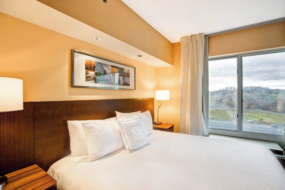 Premium bedding, down comforters, pillowtop beds, in-room safe