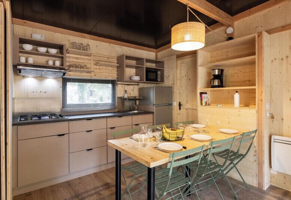 Comfort Cottage | Private kitchen | Stovetop, highchair, cookware/dishes/utensils, cleaning supplies