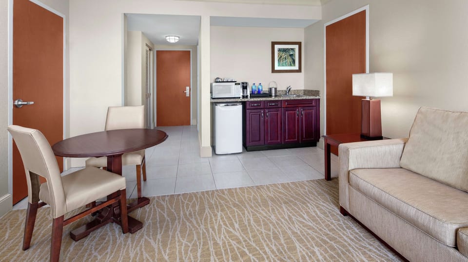 Deluxe Suite, 1 King Bed, Non Smoking | Living area | 55-inch LED TV with satellite channels, TV, Netflix