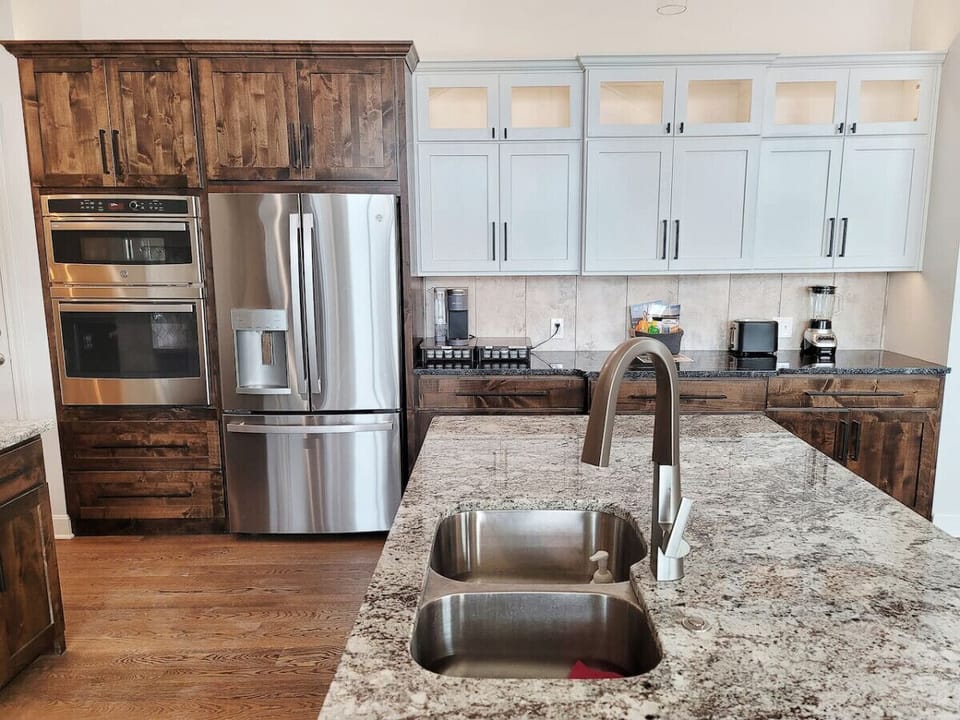 Modern kitchen with premium cookware and utensils.