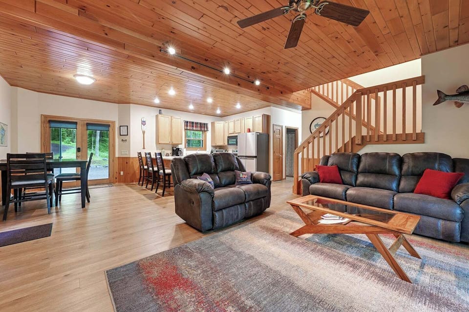 Open-Concept living room/dining/kitchen area with wood burning fireplace.  Its perfect for keeping the whole group together and enjoying great conversations!
