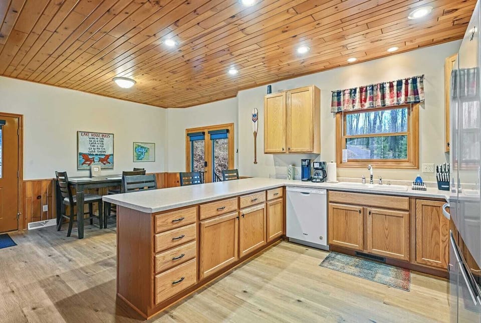 Spacious kitchen with stove, fridge, dishwasher, microwave, and all the cooking essentials such as pots, pans, and utensils.  (Due to health dept guidelines we are not allowed to leave and food/seasonings for guests use)