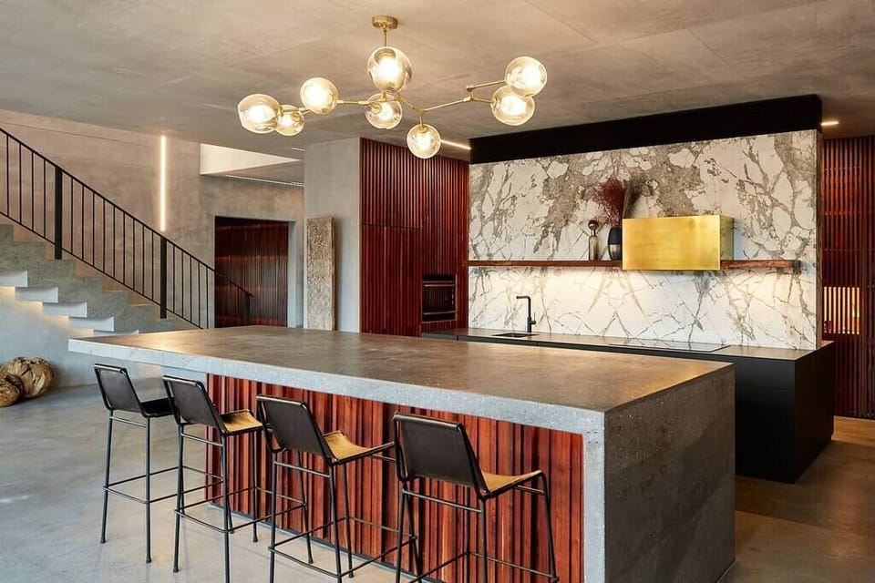 Gourmet kitchen with butlers kitchen, recessed lighting, counter with sink.