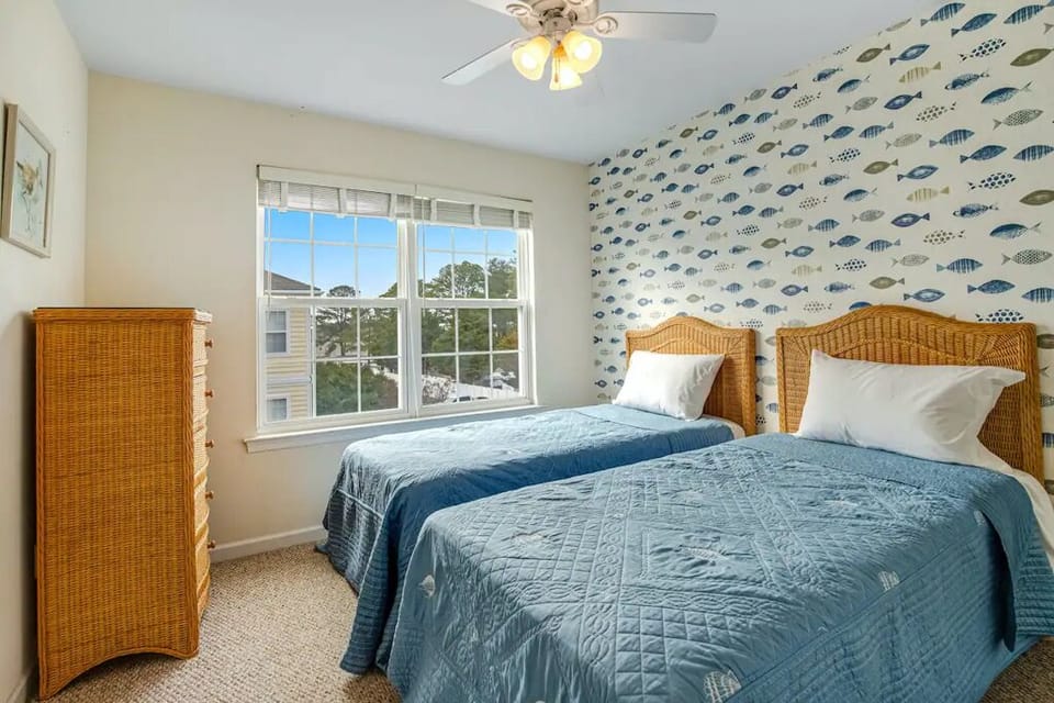 Fourth bedroom with two Twin sized beds and cute fish theme.
