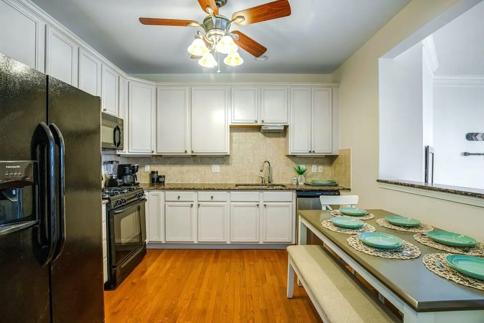 Fully equipped kitchen with gas range, microwave, and dishwasher.