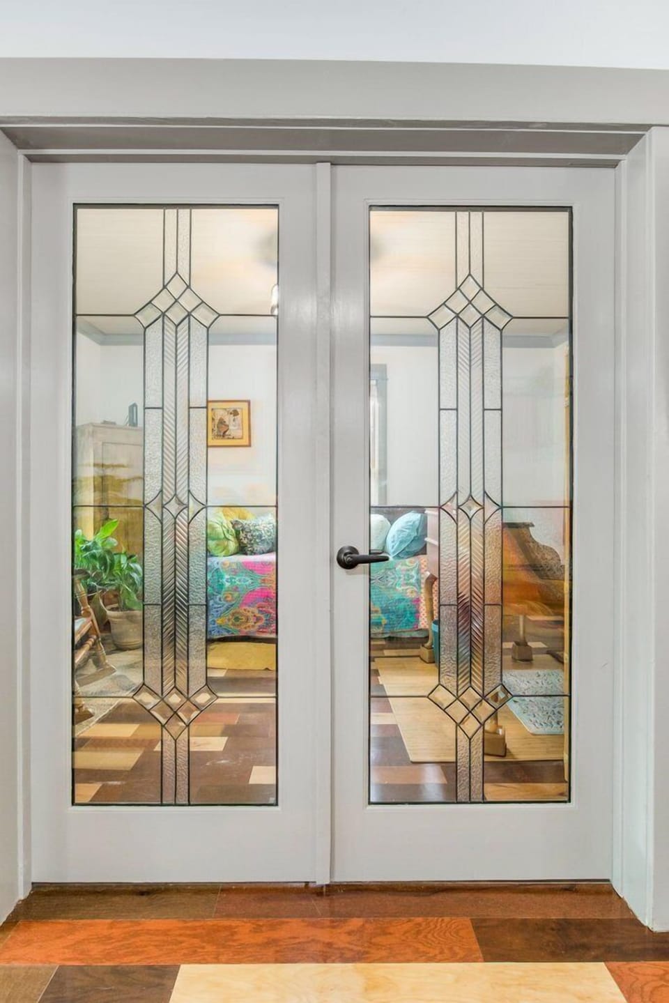 Original 1928 art deco doors at the Boho Bungalow showcase historic charm that couples appreciate in central Pensacola's Old East Hill