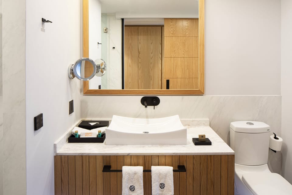 Shower, rainfall showerhead, hair dryer, towels