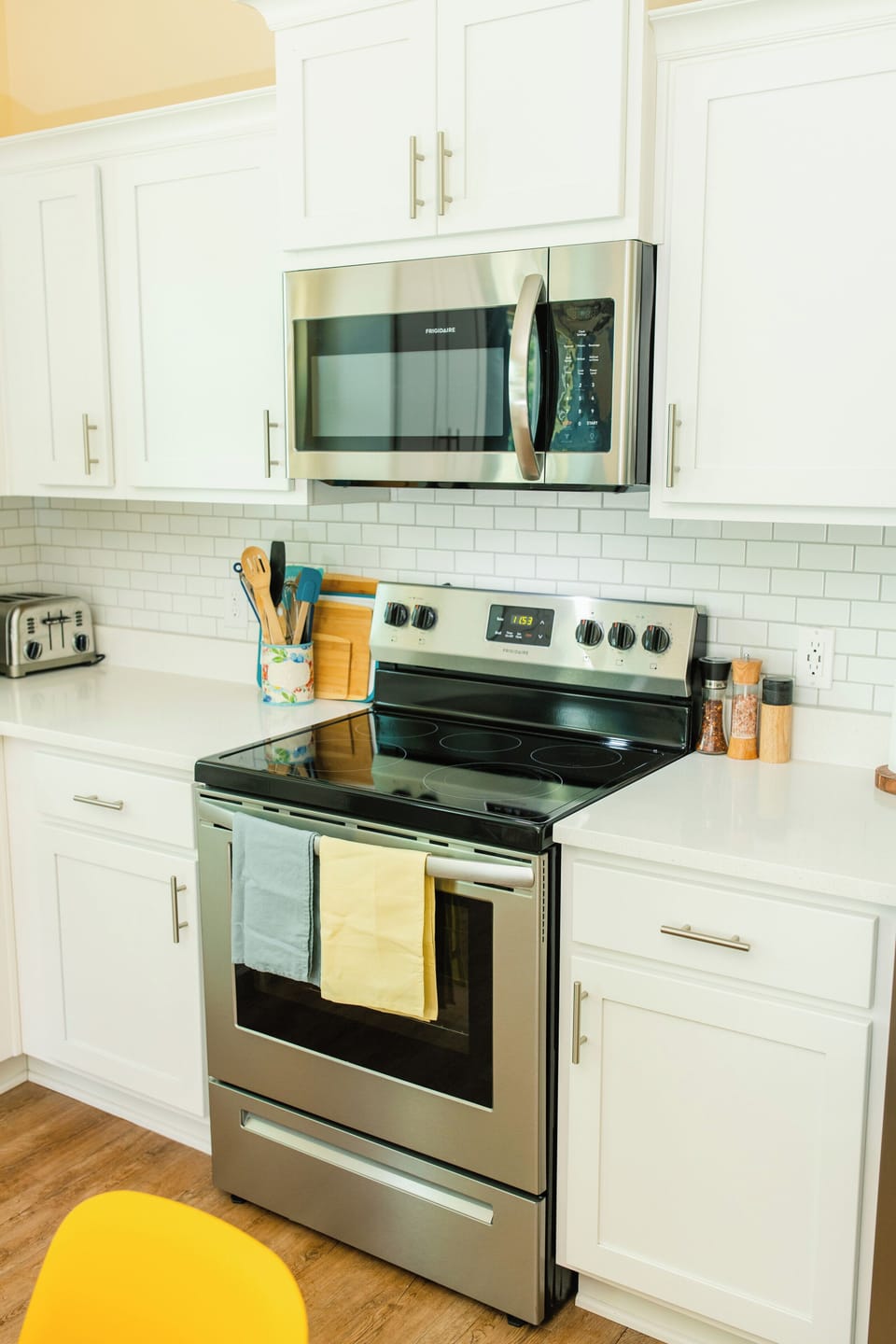 Bright modern kitchen with stainless appliances and clean white finishes