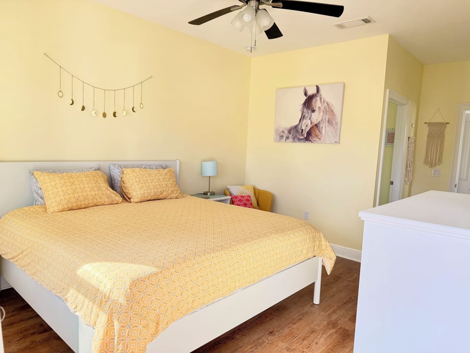 Sunny, cozy bedroom with stylish decor and a spacious bed