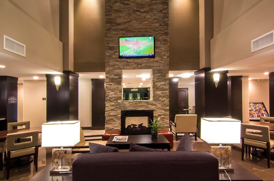Modern common area with lounge seating and fireplace.