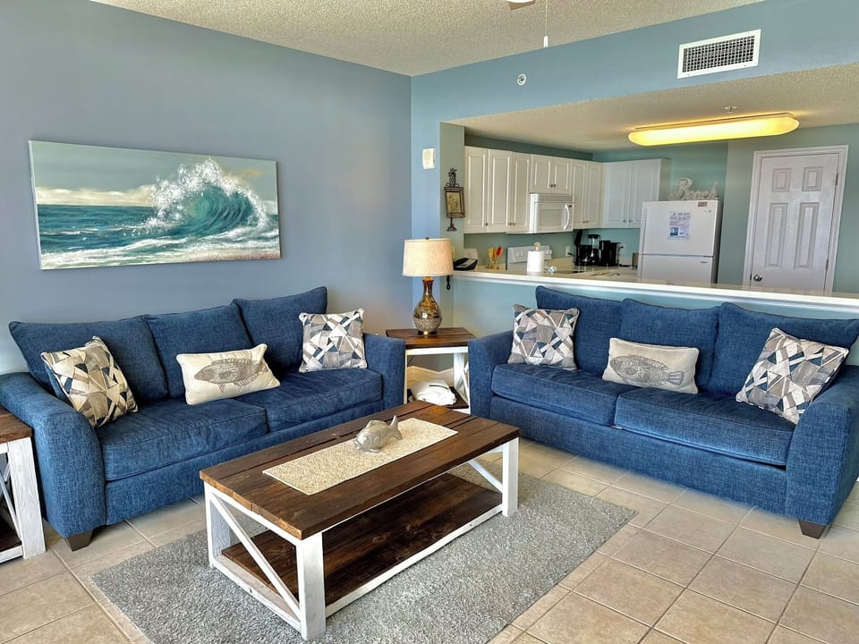 Living Room with Floor-to-Ceiling Gulf Views • Queen Sleeper Sofa • Smart TV • Steps from Beach