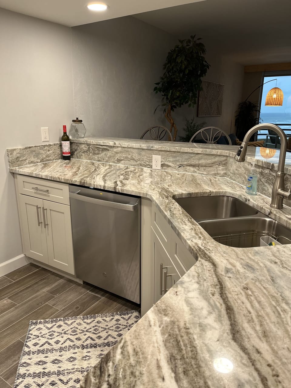 Kitchen with new granite counters and view of ocean