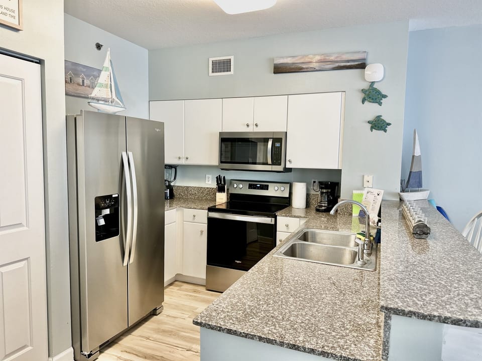 Fully Equipped Kitchen with Stainless Appliances • Granite Counters • Family Meals at the Beach