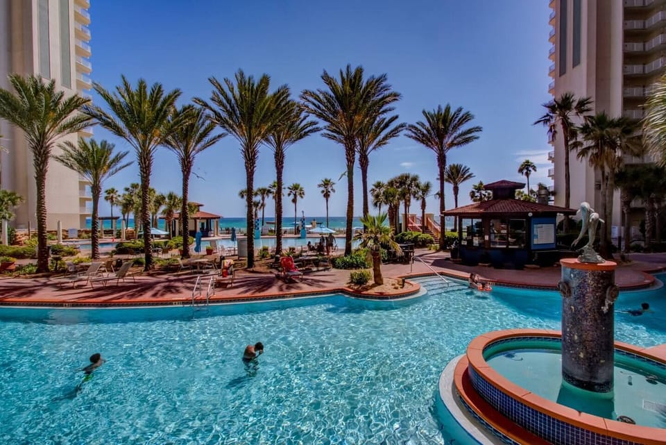 Gulf-Front Lagoon Outdoor Pool • Tiki Bar & Grill - Family-Friendly Resort 