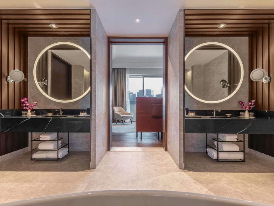 Designer toiletries, hair dryer, bathrobes, slippers