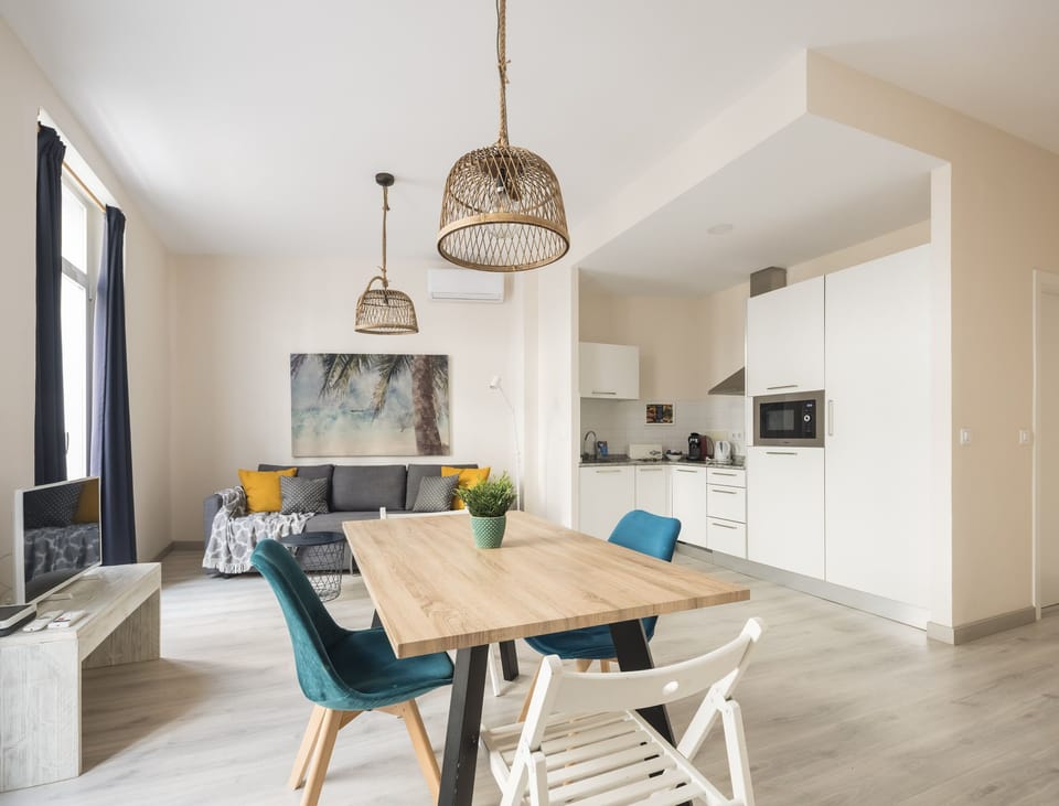 City Apartment, 1 Bedroom, City View | Laptop workspace, iron/ironing board, free cribs/infant beds
