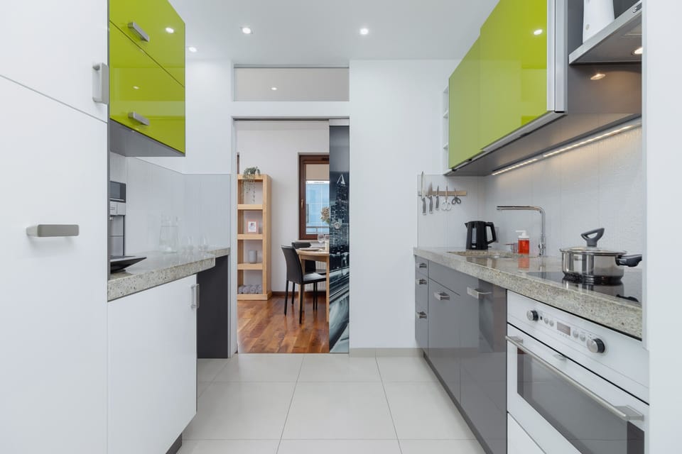 Kitchen with plenty of kitchen utensils and dishes. 