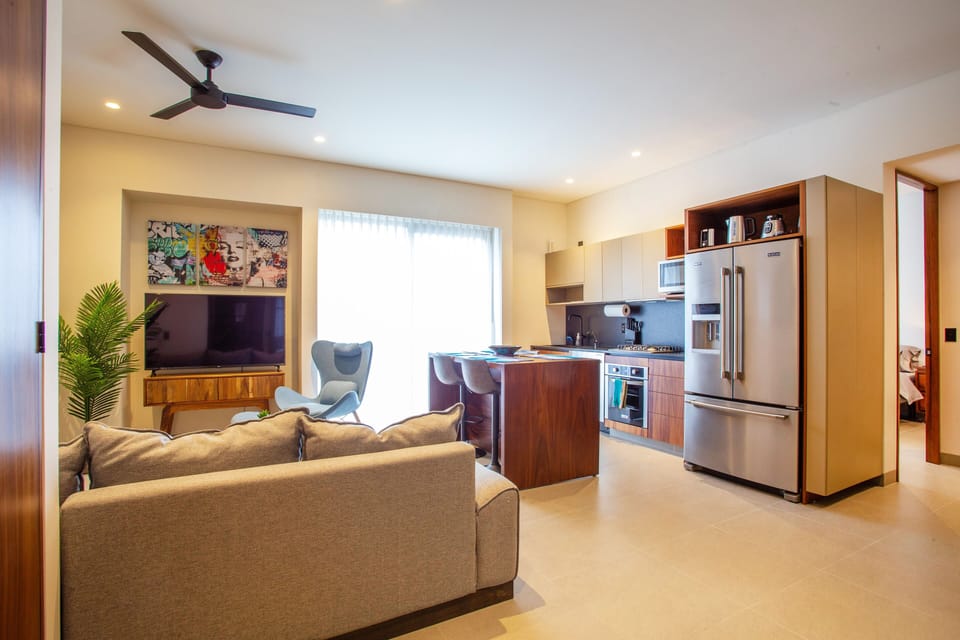 Smart TV in the middle of living/ kitchen area
