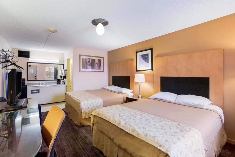 Standard Room, 2 Queen Beds, Non Smoking | Individually decorated, individually furnished, desk, blackout drapes