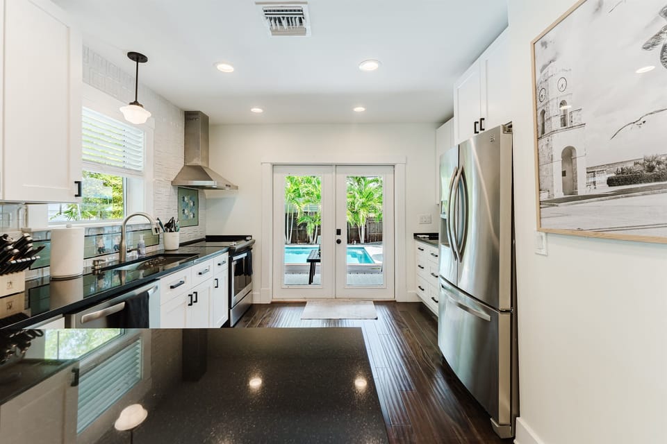 Thoughtfully equipped and beautifully appointed, the chef-inspired kitchen offers everything needed for preparing anything from beach-day snacks to gourmet dinners.