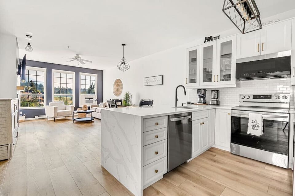 Full kitchen with a drip coffee maker, ground coffee, tea and sugar.